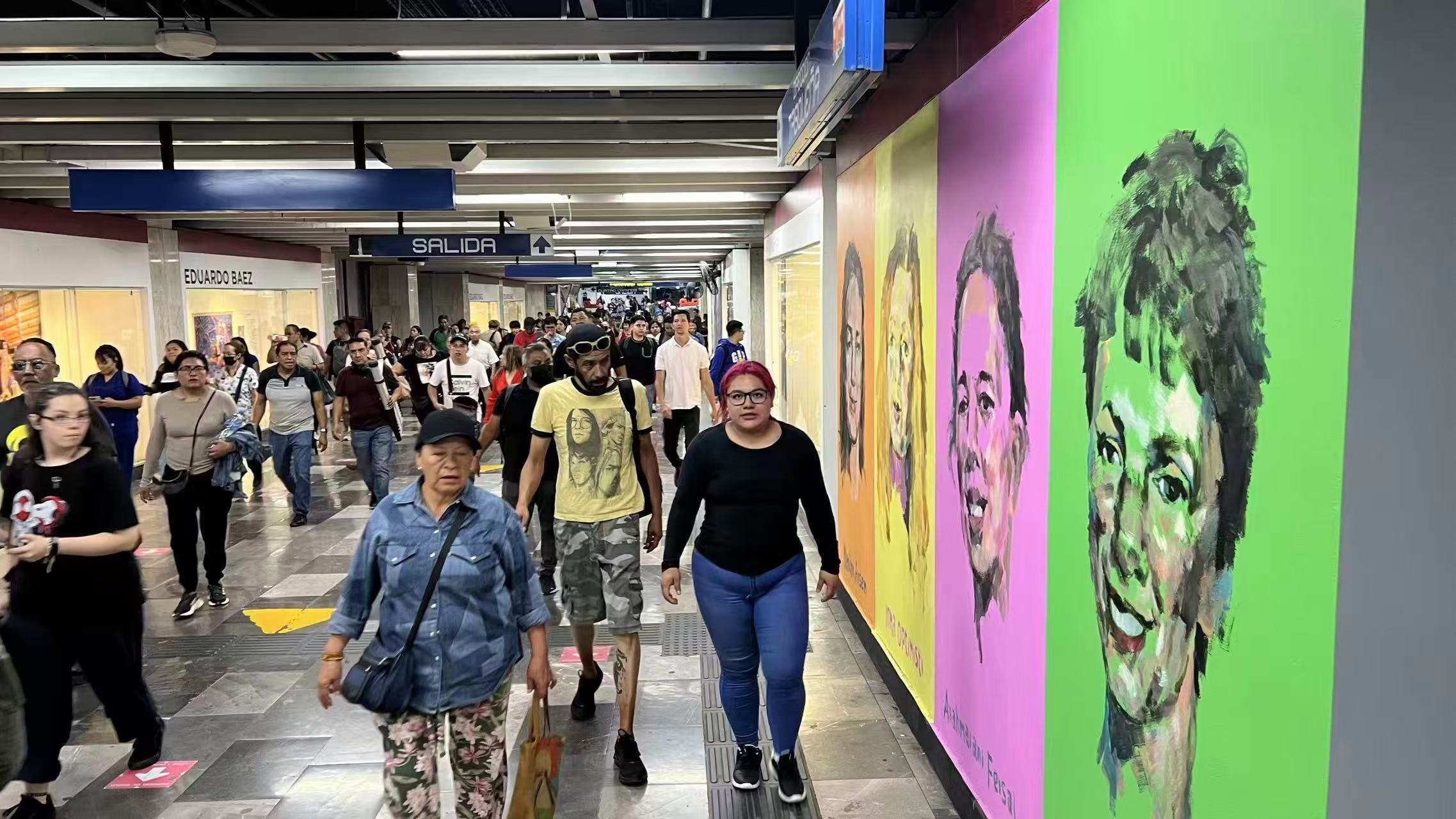 Mexico City Metro corridor with colorful portrait murals